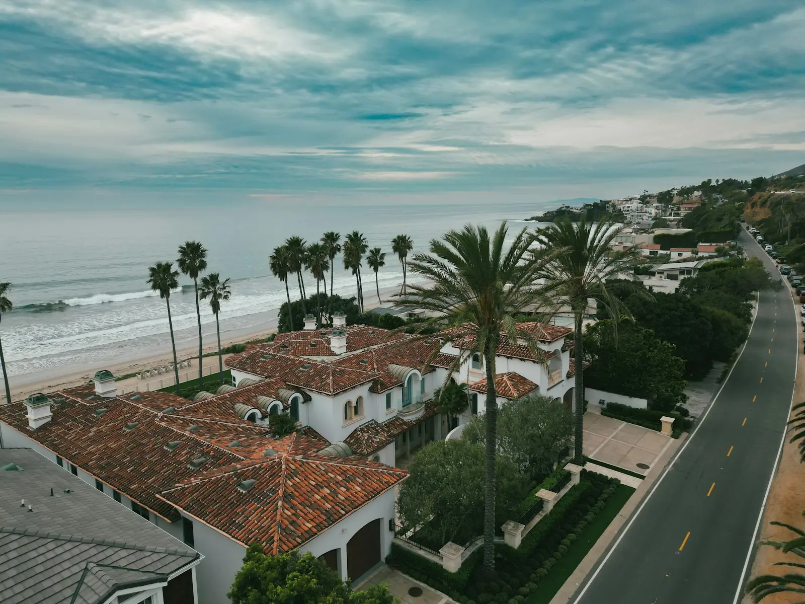 Aerial view of a Malibu home below the hills